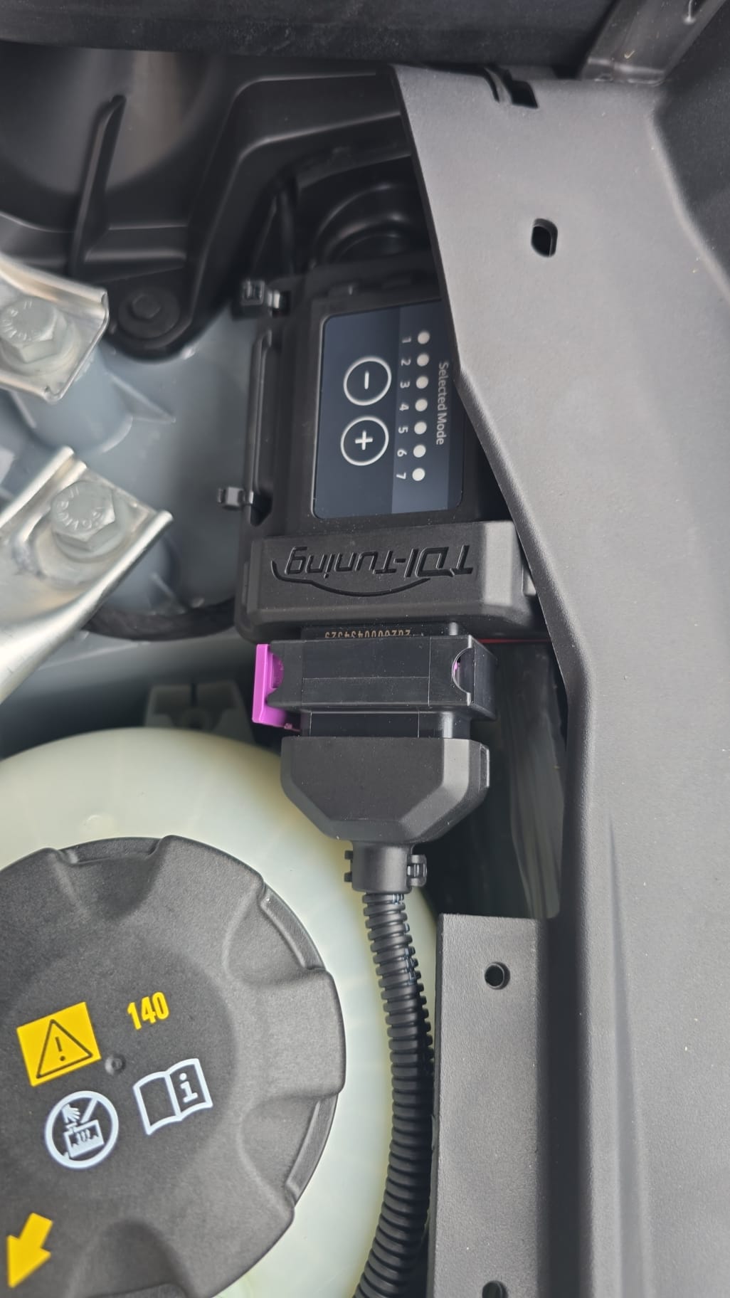 Plug-in TDI tuning box fitted in an engine bay before being replaced with a proper ECU remap