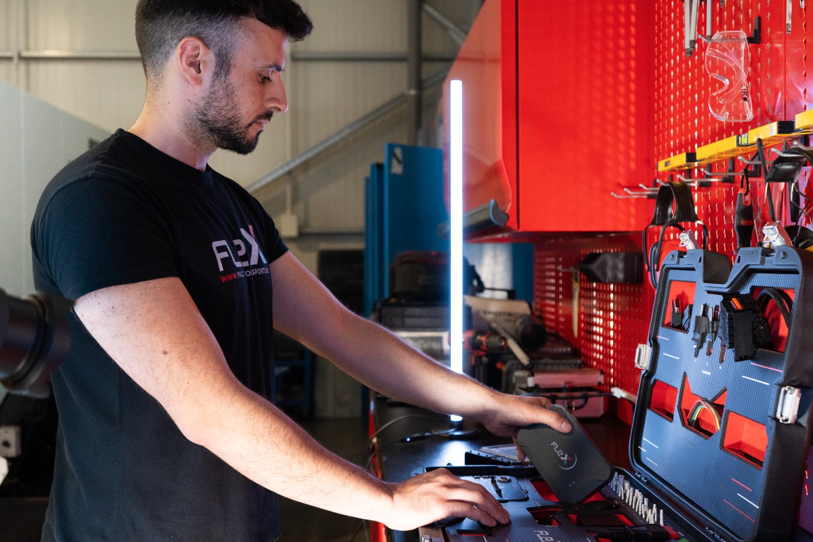 StageMyCar technician using Magic Motorsport Flex tool in workshop