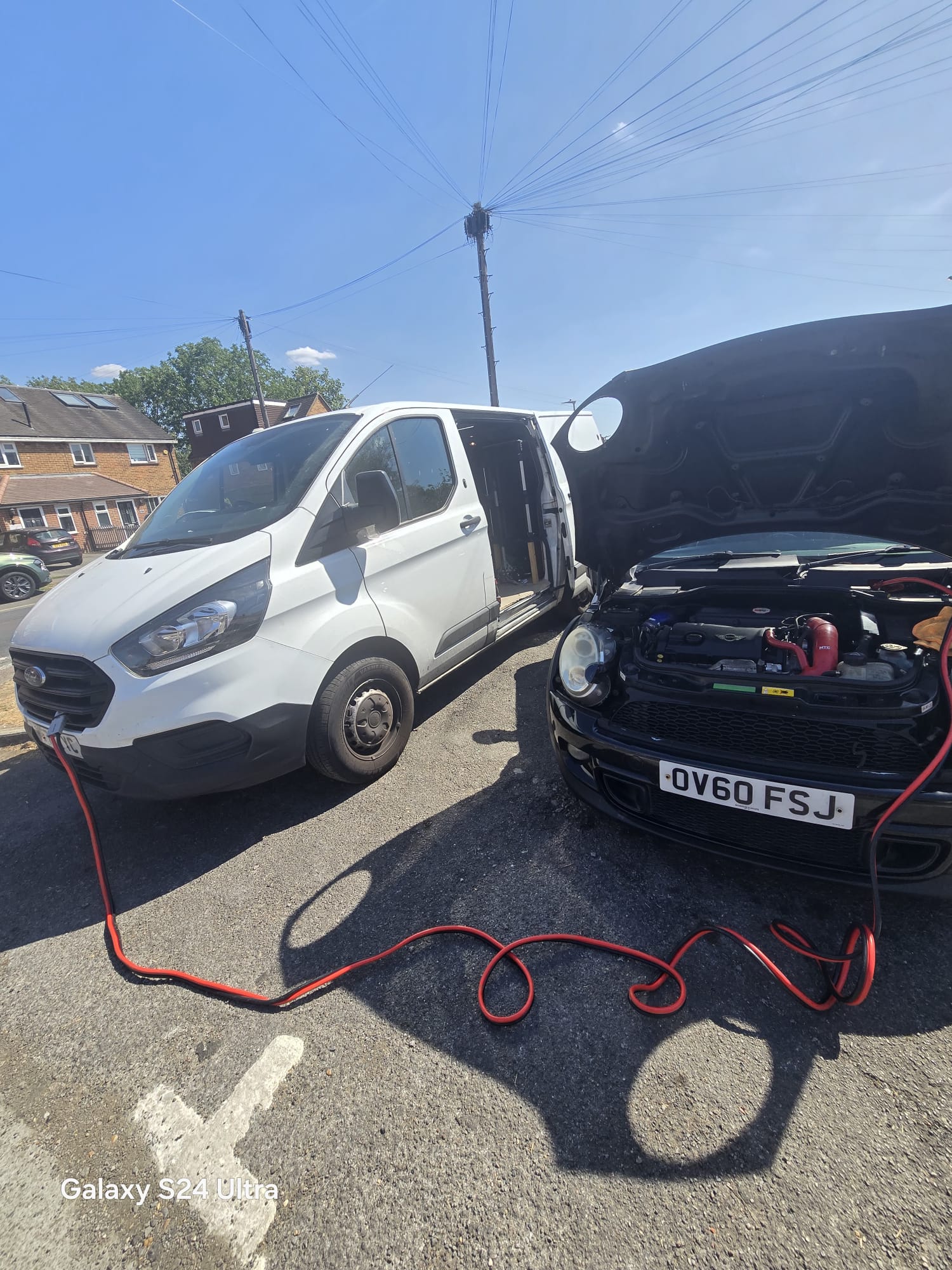 StageMyCar van jump starting a Mini with heavy duty leads at a roadside callout