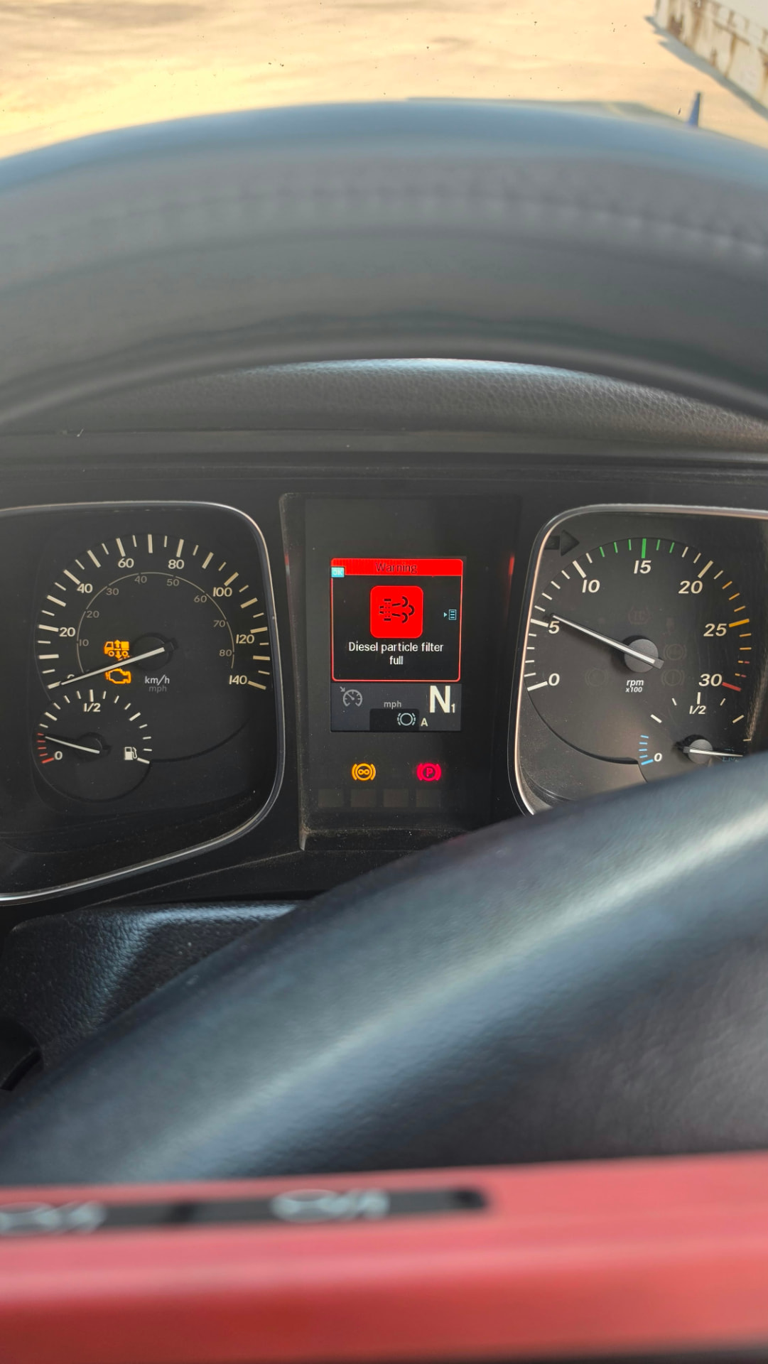 Van instrument cluster showing a red diesel particulate filter full warning message