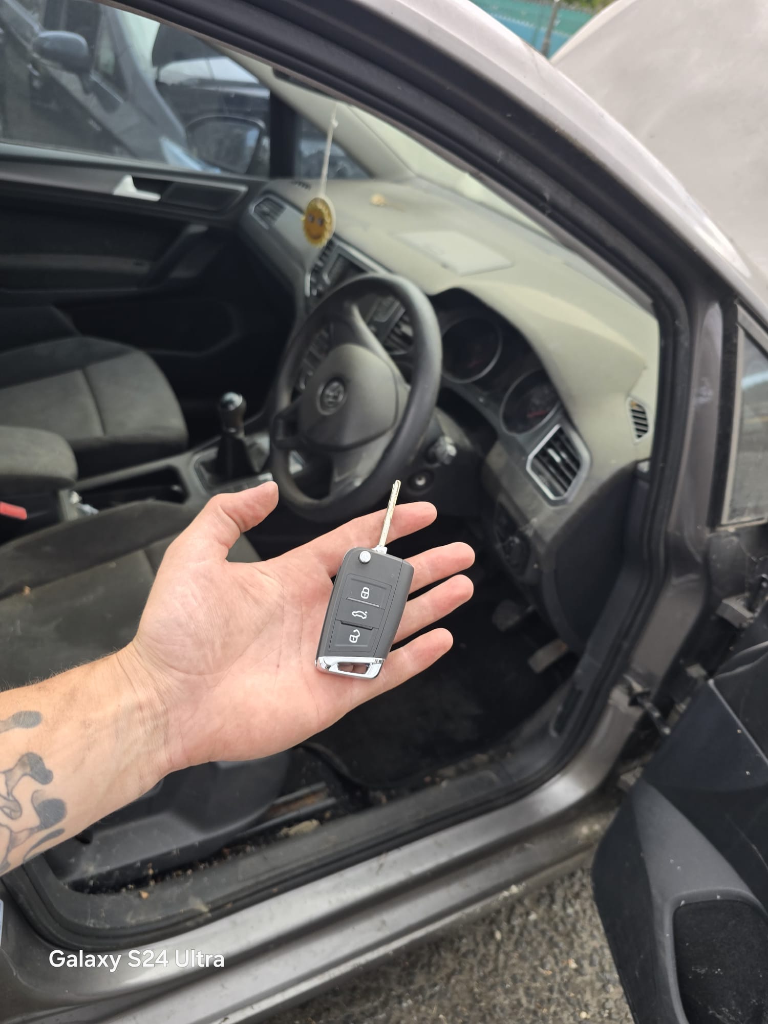 VW Golf replacement flip key cut and programmed at the driver door