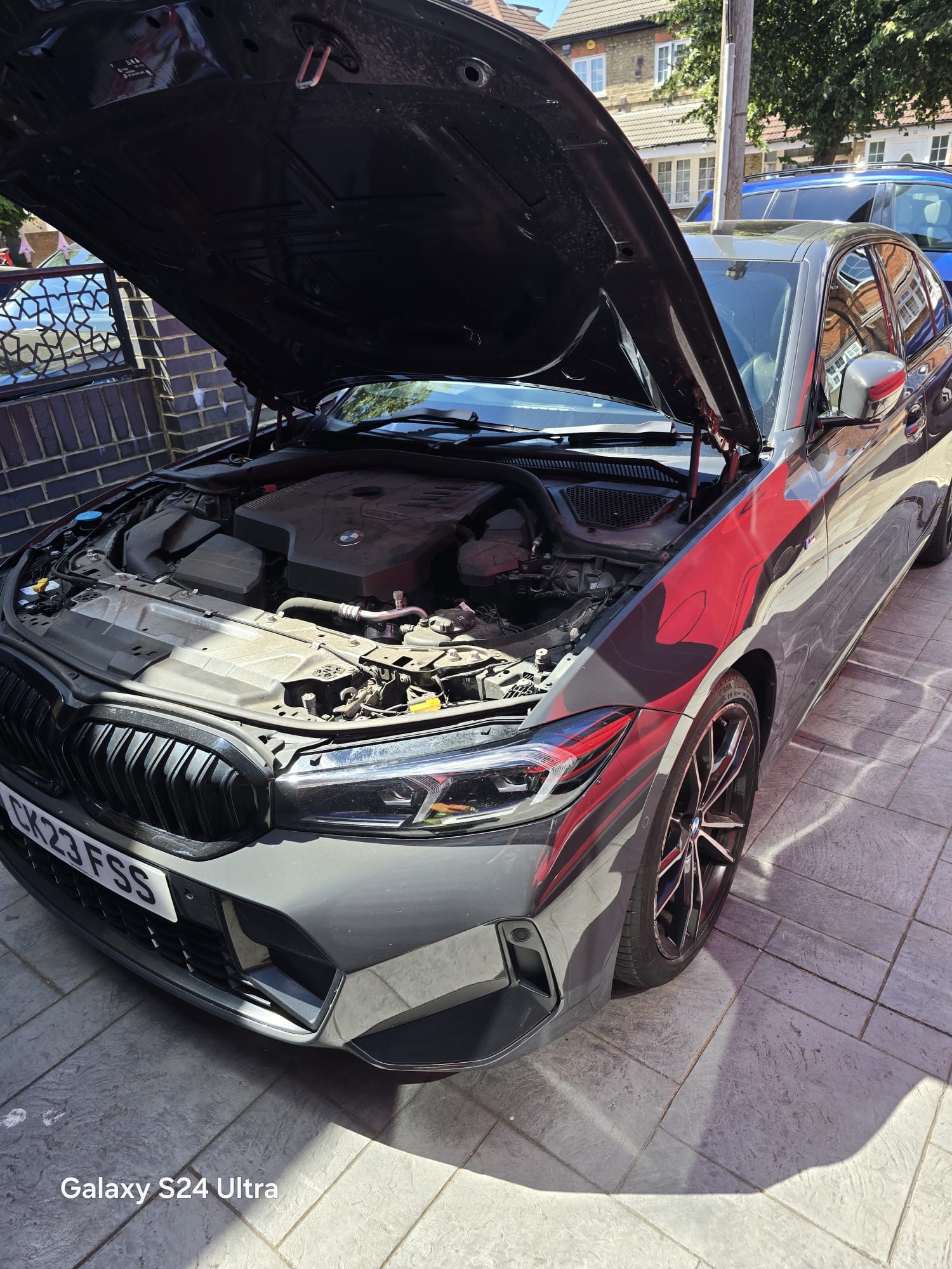 BMW 3 Series M Sport with bonnet raised during an on-site ECU tuning and diagnostic job