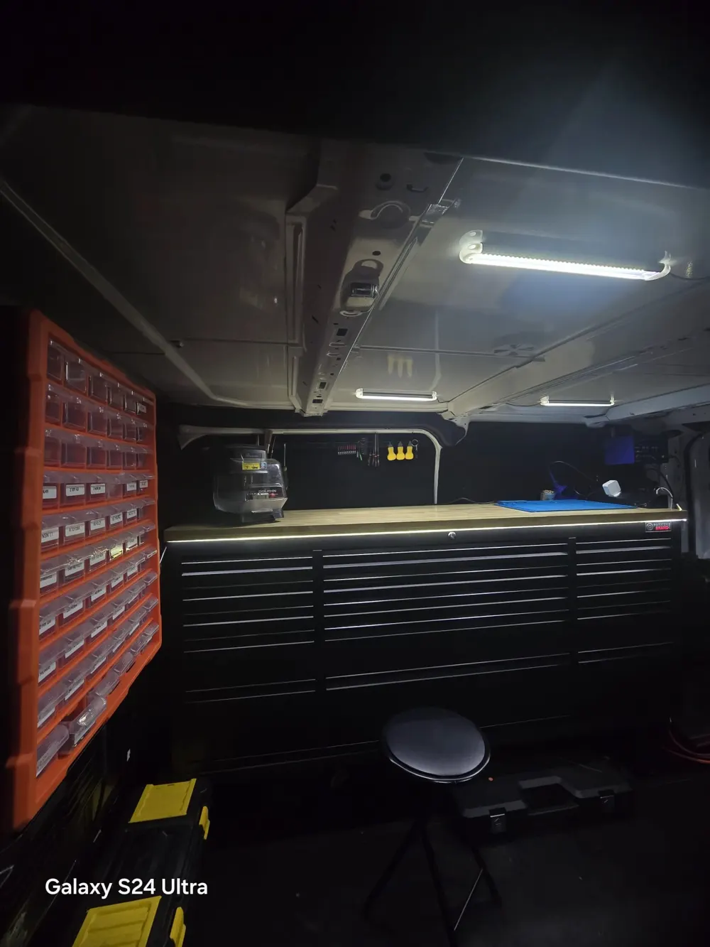 Inside the StageMyCar van: workbench, key cutting machine and labelled key blank storage