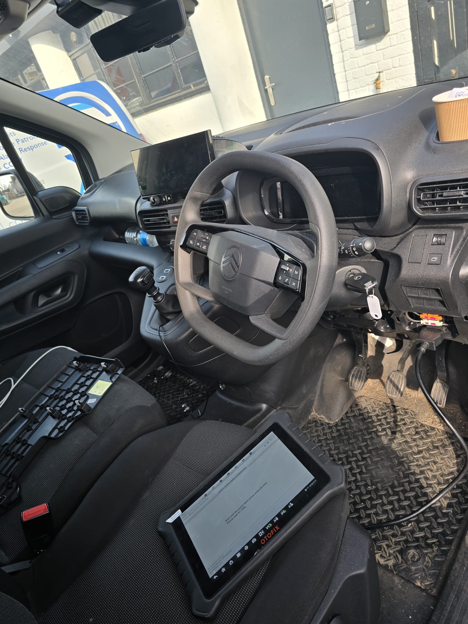 OTOFIX diagnostic tablet connected to Citroen for module coding