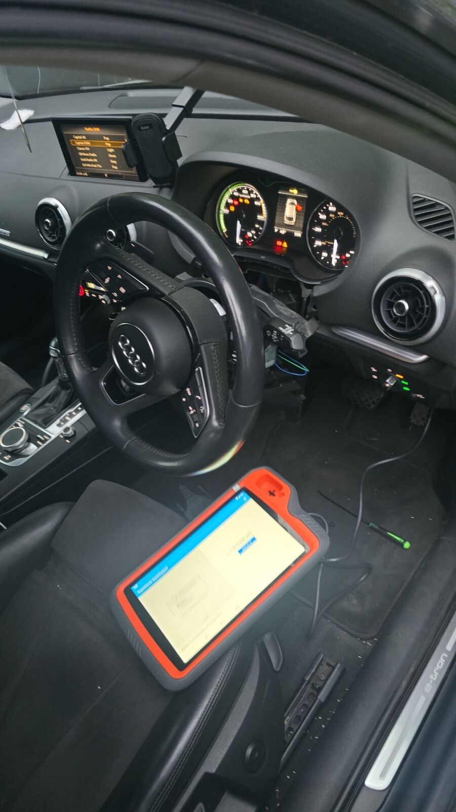 Audi A3 e-tron key programming with Xhorse Key Tool Plus on the driver's footwell